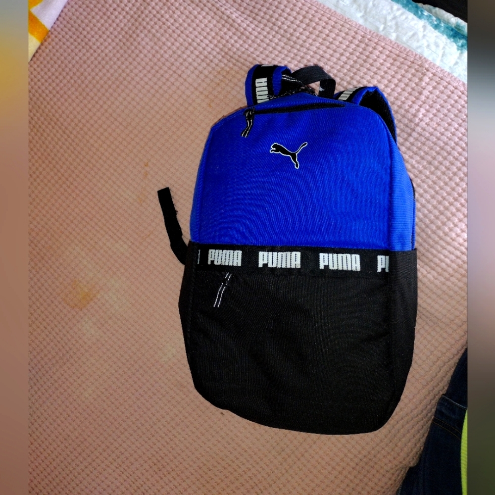 puma backpack, black and blue . Never used . School, purse, diaper bag.overnight